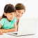 Student and parent in front of a laptop