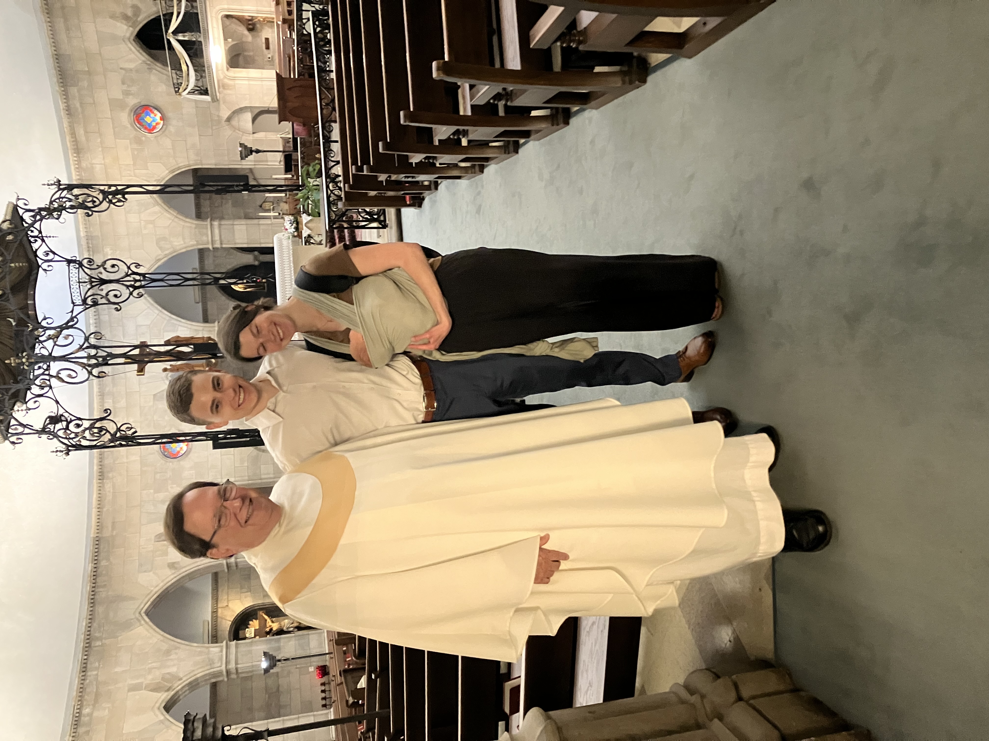Fr. Herzog with the Mueth family