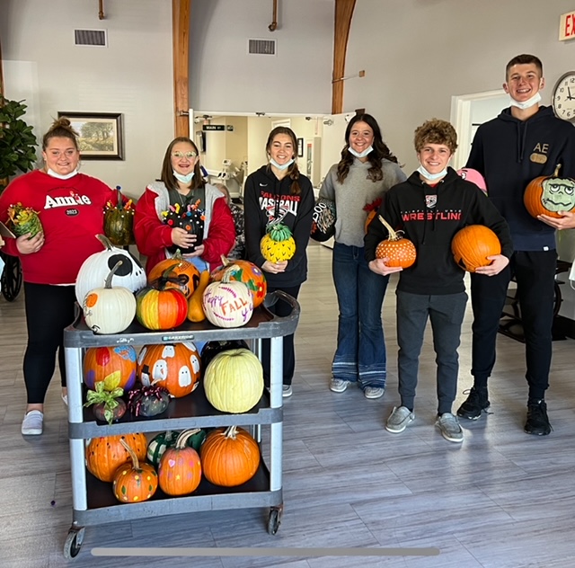 Key Club and NHS Members pictured with the finished pumpkins.