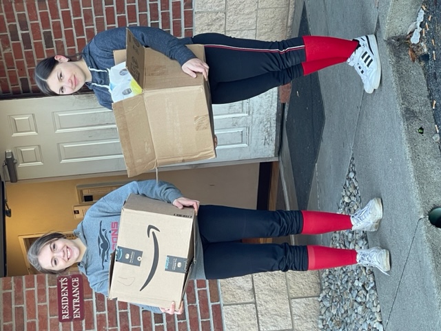 Two students delivering the supplies.