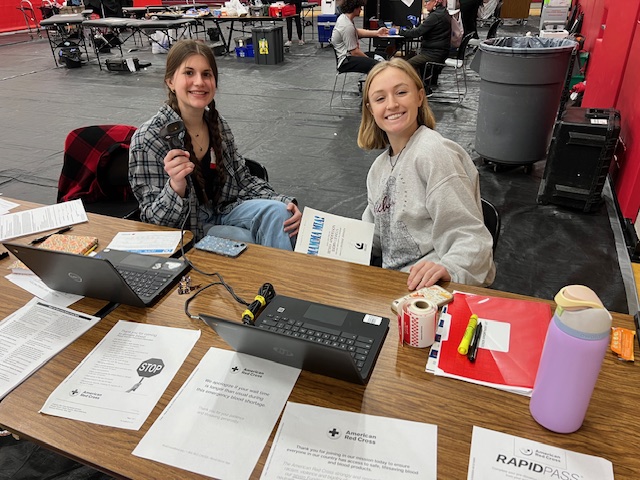 Student volunteers pictured at the check in desk.