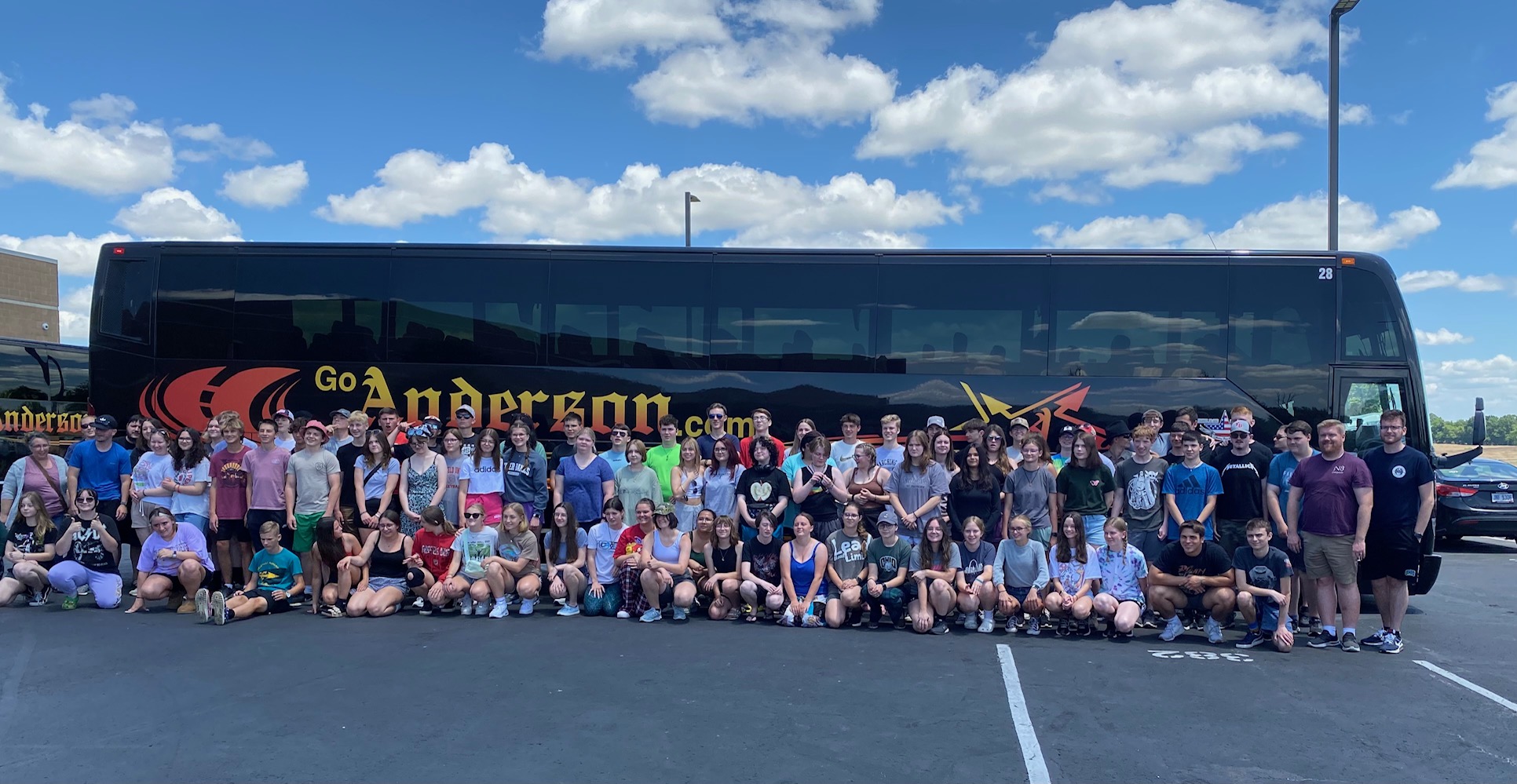 Members of the band and choir groups pictured in front of their tour bus headed to Disney.