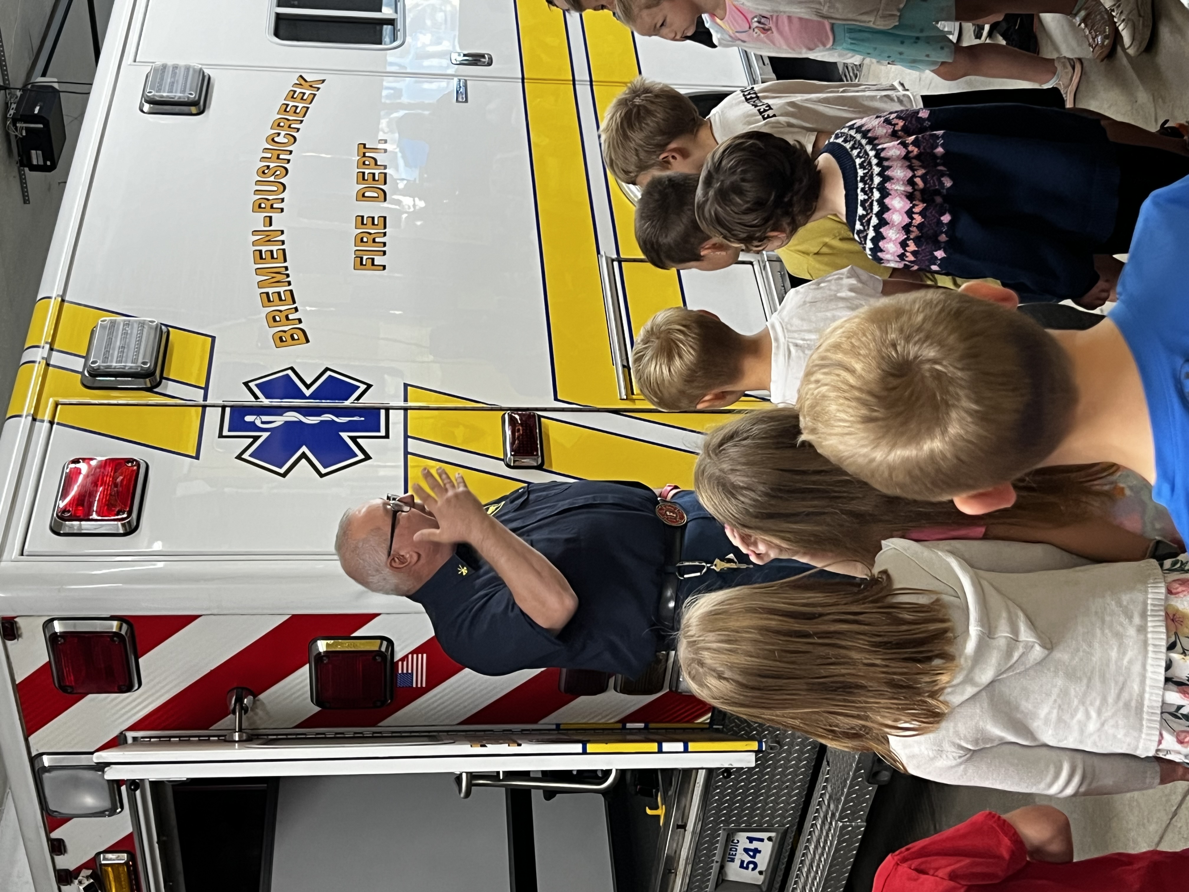 Fireman talking to students.