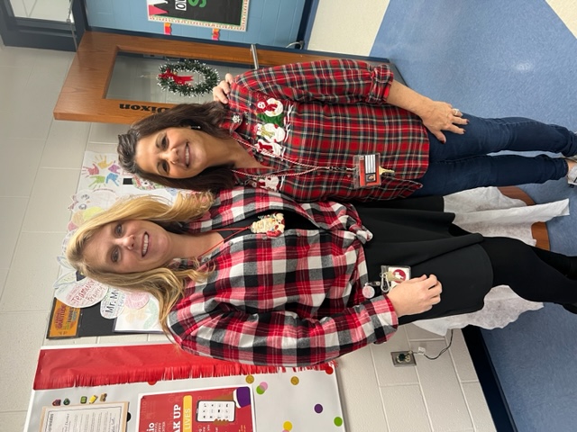 Mrs. Miller and Mrs. Peters dressed in plaid