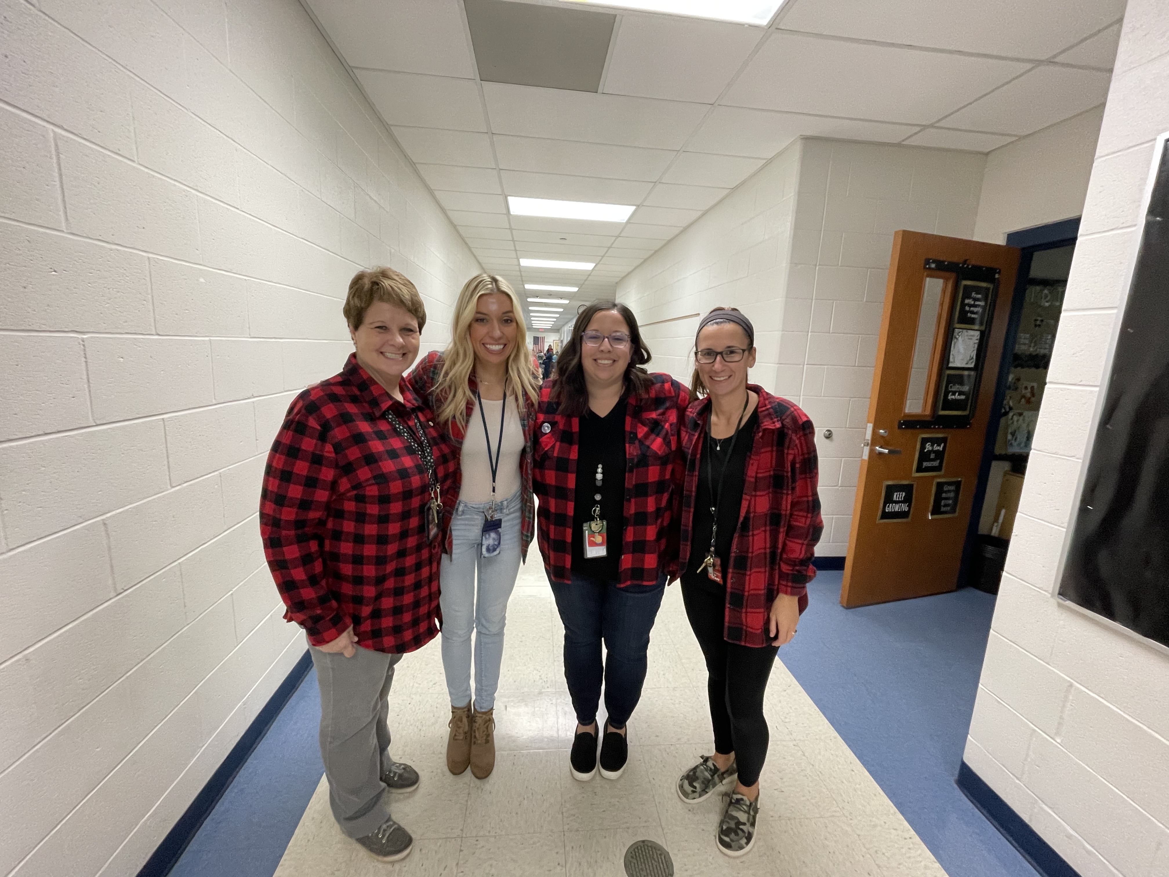 Four teachers dressed in plaid