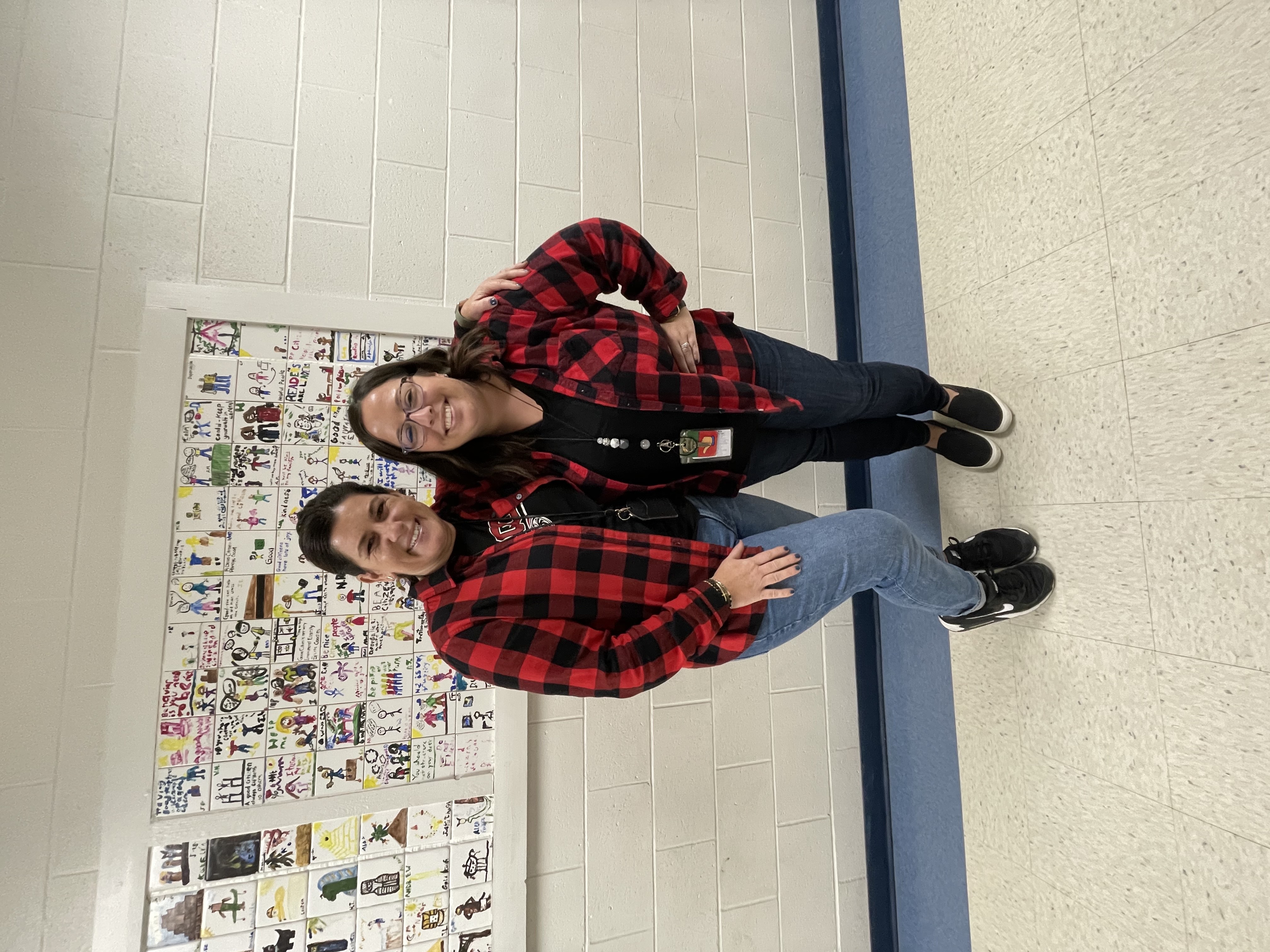 Two teachers participating in Plaid Dress Up Day