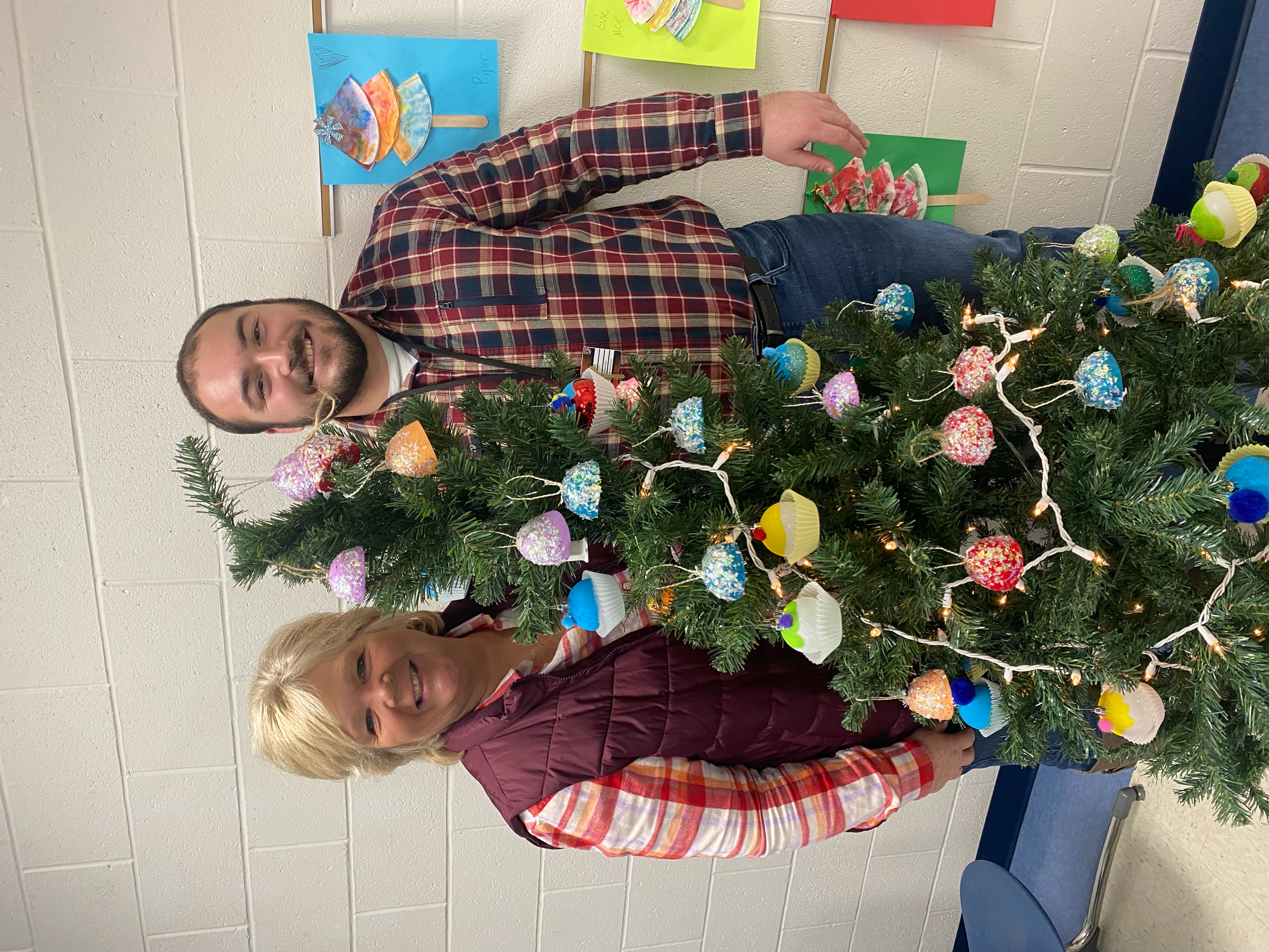 Teachers pictured with their tree.